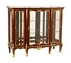 A Louis XV Style Gilt Bronze Mounted Marble-Top Vitrine Cabinet
Height 43 x width 50 1/2 x depth 19 inches.
