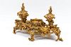 A Louis XV Style Gilt Bronze Inkstand
Height 11 x width 18 x depth 10 1/2 inches.