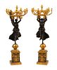 A Pair of Monumental Empire Style Gilt and Patinated Bronze Seven-Light Figural Candelabra
Height 53 1/2 inches.