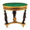 An Empire Style Gilt and Patinated Bronze Malachite-Top Table
Height 31 1/2 x diameter 34 1/2 inches.