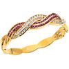 BRACELET WITH RUBIES AND DIAMONDS IN 18K YELLOW GOLD with 48 round cut rubies ~1.44 ct and 47 brilliant cut diamonds ~2.0 ct