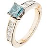 RING WITH DIAMONDS IN 14K WHITE GOLD 1 blue princess cut diamond ~0.75 ct Clarity: I2-I3 and 8 princess cut diamonds