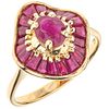 RING WITH RUBIES IN 14K YELLOW GOLD with 21 trapezoide and oval cut rubies ~1.36 ct Weight: 3.9 g. Size: 7 ¼