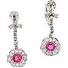 PAIR OF EARRINGS WITH RUBIES AND DIAMONDS IN 12K WHITE GOLD with 2 round cut rubies ~0.60 ct and 44 8x8 cut diamonds ~0.50 ct