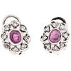PAIR OF EARRINGS WITH RUBIES AND DIAMONDS IN PALLADIUM SILVER with 2 oval cut rubies ~0.50 ct and 16 8x8 cut diamonds ~0.30 ct