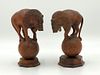 Pair of Carved Rosewood Lions on Spheres