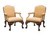 A Pair of Irish George II Style Parcel Gilt Carved Mahogany Library Chairs