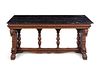 A Karpen Renaissance Revival Carved Oak Marble-Top Table