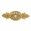 An early 20th century 15ct gold diamond brooch. The old-cut diamond star, within an oval-shape panel