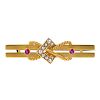 A late 19th century 15ct gold ruby and split pearl brooch. The stylised rope-twist and split pearl b