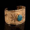 An Isaac Dial Yellow Gold and Lone Mountain Turquoise Cuff Bracelet