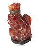 A CHINESE CARVED RED AGATE SCULPTURE, 20TH CENTURY 