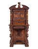 A Renaissance Revival Carved Walnut Cabinet on Stand