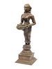 An Indian Patinated Metal Figure of a Standing Deity 