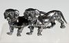 A FIGURE OF TWO DACHSHUND HOUNDS IN SILVER-PLATE BRONZE