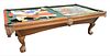 Brunswick Slate Top Pool Table having leather pockets and ball and claw feet, along with cues and balls, overall 5' x 9' 2".