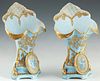 Diminutive Pair of Continental Porcelain Flare Vases, 19th c., with gilt and floral medallion decoration, on a pale blue ground, H.- 11 in., W.- 7 in.