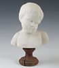 Continental Carved Marble Bust of a Child, late 19th c., on a wooden socle base, H.- 10 5/8 in., W.- 6 1/2 in., D.- 4 1/4 in.