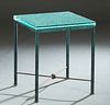 Mario Villa (1953-, Nicaragua/New Orleans), "Patinated Steel Side Table," 20th c., the thick glass top on tubular legs joined by an X-form stretcher, 