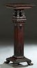 American Carved Mahogany Pedestal, late 19th c., the carved rounded edge square top on a stepped square support with applied leaf and scroll carving, 