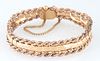 Vintage 18K Yellow and Rose Gold Link Bracelet, with a central curved row of yellow gold links within rope twist borders of rose gold, with a safety c