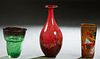 Three Murano Glass Pieces, 20th c., consisting of a square ocher millefiori vase, signed indistinctly on the bottom; a tall red bottle form vase with 
