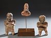Group of Three Pre-Columbian Clay Figures, a pair of a standing man and woman with painted decoration, and a fragment of a man with a headdress, on a 
