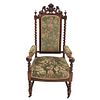 Sillón. Francia. SXX Estilo Enrique II. En talla de madera de roble. Con respaldo cerrado y asiento acojinado en tapicería color verde.