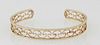Lady's 18K Yellow Gold Bangle Bracelet, the sides joined by open wave decoration, Int. H.- 2 in., W.- 2 3/8 in., Wt.- .27 Troy Oz. Provenance: The Est