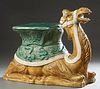 Glazed Ceramic Garden Seat, 20th c., in the form of a kneeling camel, H.- 21 1/2 in., W.- 12 1/2 in., D.- 28 in.