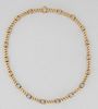 18K White and Yellow Gold Link Choker, each of the 19 twisted links separated by 19 circular bead spacers, the central six spacers of white gold mount