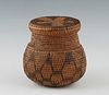 Southwestern Native American Basket, late 19th/early 20th c., possibly Apache, the tri-color covered storage jar with fitted lid and star motif, the b