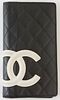 Chanel Cambon Black and Neon Pink Quilted Leather Bifold Wallet, c. 2009-2010, the calf leather with white "CC" logo sewn on exterior, opening to a ca