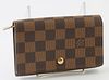 Louis Vuitton Brown Porte-Tresor Zip Wallet, the coated canvas damier ebene with a golden brass accent snap, opening to four small bill compartments, 