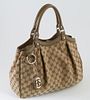 Gucci Khaki Green Monogrammed Canvas PM Sukey Shoulder Bag, the top with a magnetic leather and silver clasp, opening to a beige canvas interior with 