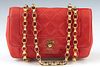 Chanel Red Leather Quilted Purse, with gold hardware, the interior of the bag lined in matching red leather with an open side compartment and a zip cl