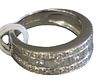 18 Karat White Gold Band, set with three rows of diamonds, center having alternating round and baquette diamonds, signed Michael's, size 6 1/4.  