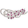 BROOCH WITH RUBIES AND DIAMONDS IN 18K WHITE GOLD 16 Round cut rubies ~2.40 ct and 85 Diamonds (different cuts) ~1.30 ct