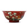 A CHINESE RED-GROUND FAMILLE ROSE FLOWERS BOWL
