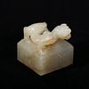 A WHITE AND BEIGE CHILONG JADE SEAL 