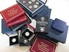 A collection of cased modern British silver proof, commemorative and other coins, including 1984-87