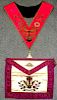 A Rose Croix Masonic apron and collar, heavily embroidered, the collar suspended with a gemset jewel