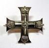A silver and gold coloured brooch formed as a miniature Military Cross, associated with the Military