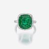 An emerald, diamond, and platinum ring