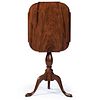 A Federal Figured and Carved Walnut Tilt-Top Candlestand with Shaped Top, Mid-Atlantic States, Circa 1790
