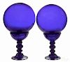 Pair of cobalt blown glass witch balls and holde