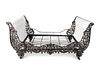 A Continental Cast Iron Sleigh Daybed
Height 41 x width 82 x depth 45 1/2 inches.