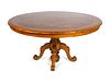 A Continental Parquetry Walnut Center Table
Height 32 1/2 x diameter 62 1/2 inches.
