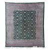 TAPETE SIGLO XX IRAN ESTILO TEKKE Elaborado en lana Decorado con motivos geométricos sobre fondo verde Firmado 280 x 250 cm.