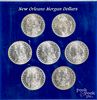 Seven New Orleans Morgan silver dollars
